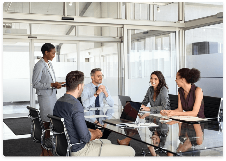 
                  A team of professionals in a business meeting, with one standing and presenting,
                  symbolizing the accounting and bookkeeping services provided by kept.pro for marketing agencies,
                  emphasizing efficiency and financial management.
                